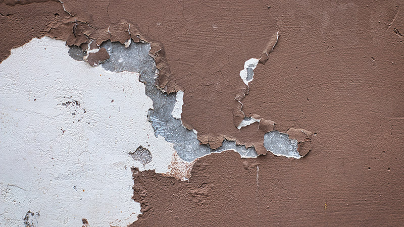 time to repaint your commercial building when paint starts to peel